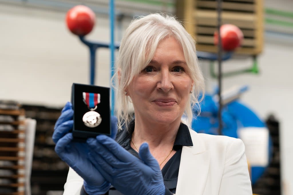 Culture Secretary Nadine Dorries during a visit to the Worcestershire Medal Service factory in Birmingham where the Queen’s Platinum Jubilee Medal is being produced (Joe Giddens/PA)