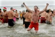 NEW YORK, NY - JANUARY 1: A man reacts after plunging into the frigid water during the Coney Island Polar Bear Club's New Year's Day swim on January 1, 2013 in the Coney Island neighborhood of the Brooklyn borough of New York City. The annual event attracts hundreds who brave the icy Atlantic waters and temperatures in the upper 30's as a way to celebrate the first day of the new year. (Photo by Monika Graff/Getty Images)