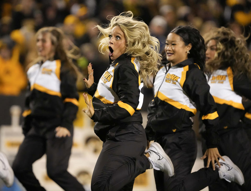 Members of the University of Iowa Spirit Squad perform a dance routine during a timeout between Iowa and Rutgers in the first half of an NCAA college football game, Saturday, Nov. 11, 2023, in Iowa City, Iowa. (AP Photo/Bryon Houlgrave)
