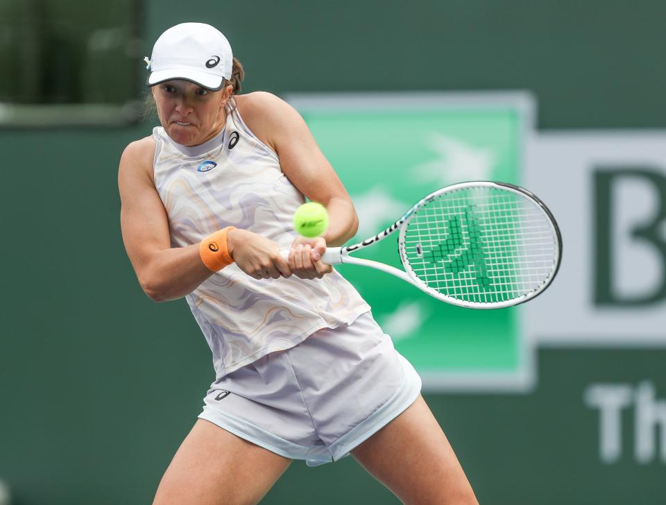 Iga Swiatek hits a shot during her win over  Claire Liu at the BNP Paribas Open in Indian Wells, Calif., March 11, 2023. 