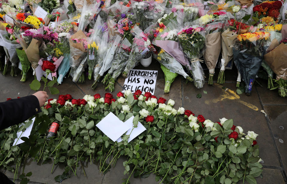 <p>A rose is laid among floral tributes for the victims of the attack on London Bridge and Borough Market at London Bridge, London, Britain June 6, 2017. (Photo: Marko Djurica/Reuters) </p>