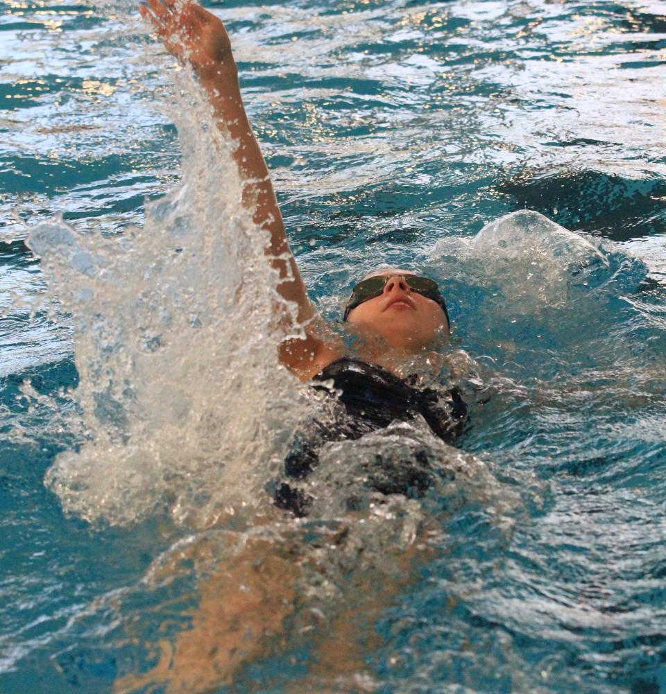 Zanesville senior Abigail Baldwin swims the backstroke in the 200 medley relay during the Licking County League championships at Kenyon on Saturday, Feb. 4, 2023.