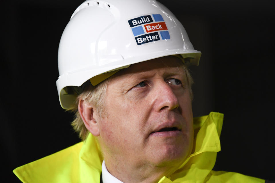 Britain's Prime Minister Boris Johnson visits the Conway Heathrow Asphalt & Recycling Plant construction site in west London, Saturday, Oct. 3, 2020. (AP Photo/Alberto Pezzali)