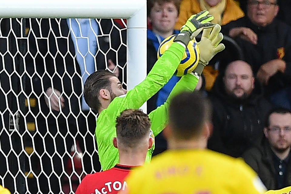 Manchester United's Spanish goalkeeper David de Gea fumbles a shot from Watford's Senegalese midfielder Ismaila Sarr into his own net during the English Premier League football match between Watford and Manchester United at Vicarage Road Stadium in Watford, north of London on December 22, 2019. (Photo by DANIEL LEAL-OLIVAS / AFP) / RESTRICTED TO EDITORIAL USE. No use with unauthorized audio, video, data, fixture lists, club/league logos or 'live' services. Online in-match use limited to 120 images. An additional 40 images may be used in extra time. No video emulation. Social media in-match use limited to 120 images. An additional 40 images may be used in extra time. No use in betting publications, games or single club/league/player publications. /  (Photo by DANIEL LEAL-OLIVAS/AFP via Getty Images)