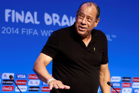 Former Brazilian soccer captain Carlos Alberto Torres arrives for a news conference ahead of the draw for the 2014 World Cup at the Costa do Sauipe resort in Sao Joao da Mata, Bahia state, December 5, 2013. REUTERS/Sergio Moraes/File Photo