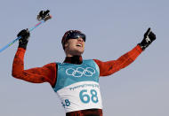 <p>Dario Cologna, of Switzerland, celebrates winning the gold medal in the men’s 15km freestyle cross-country skiing competition. (AP) </p>