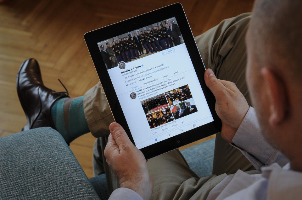 A man holds an iPad with Donald Trump's Twitter feed visible on November 10, 2017. (Photo by Jaap Arriens/NurPhoto via Getty Images)