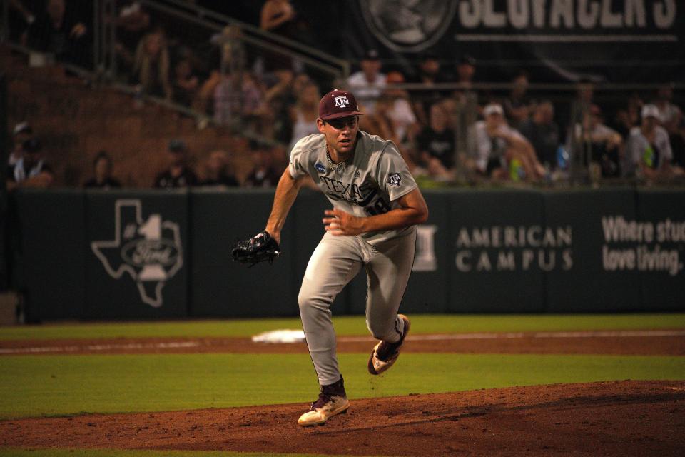 Texas A&M Aggies pitcher Ryan Prager (18) chases a ground ball hit by the Texas Longhorns during the second round in the NCAA baseball College Station Regional at Olsen Field College Station.