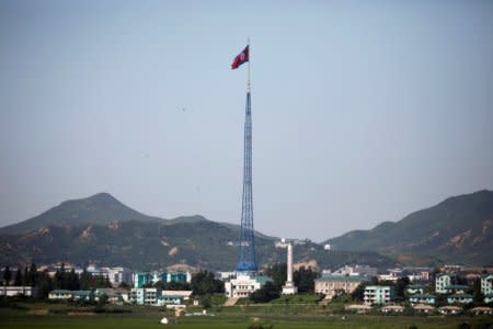 FILE PHOTO: A North Korean flag flutters on top of a tower at the propaganda village of Gijungdong in North Korea, in this picture taken near the truce village of Panmunjom, South Korea, August 26, 2017.  REUTERS/Kim Hong-Ji