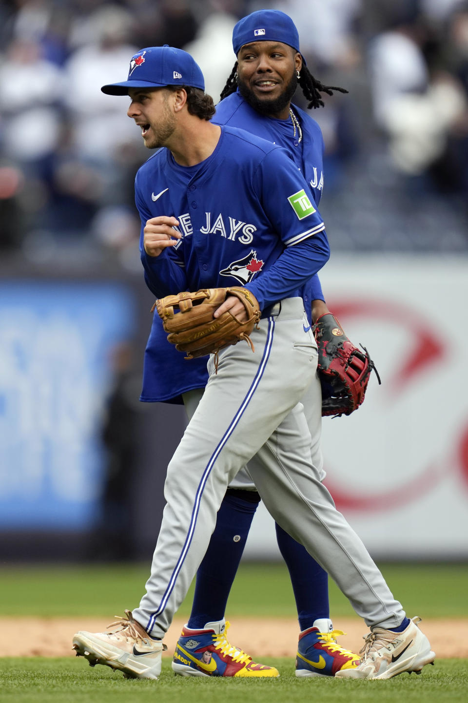 Toronto Blue Jays' Ernie Clement, left, and Vladimir Guerrero Jr. celebrate after the baseball game against the New York Yankees at Yankee Stadium Friday, April 5, 2024, in New York. The Blue Jays defeated the Yankees 3-0. (AP Photo/Seth Wenig)