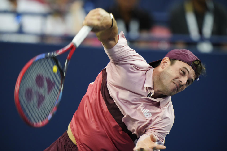 Tommy Paul, of the United States, serves to Jannik Sinner, of Italy, during men's tennis match action at the National Bank Open in Toronto, Saturday, Aug. 12, 2023. (Frank Gunn/The Canadian Press via AP)