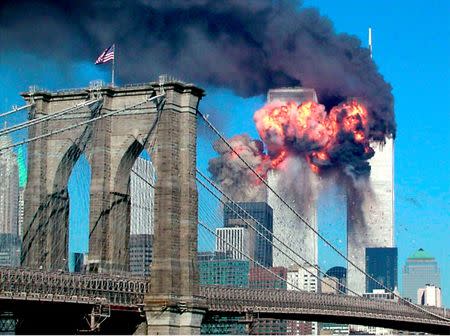 The second tower of the World Trade Center bursts into flames after being hit by a hijacked airplane in New York in this September 11, 2001 file photograph. REUTERS/Sara K. Schwittek/Files