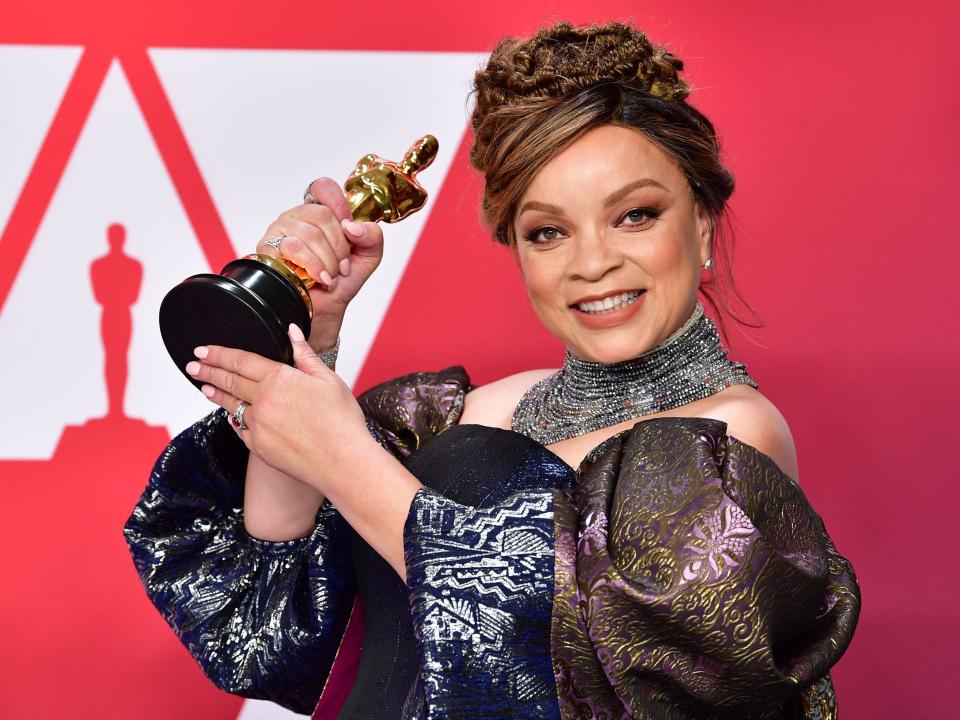 Ruth E. Carter holds her Oscar won for best costume design for "Black Panther"