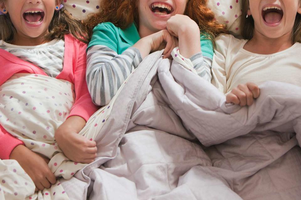 <p>Getty</p> Stock image of a sleepover