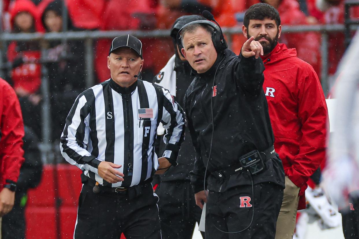 Oct 14, 2023; Piscataway, New Jersey, USA; Rutgers Scarlet Knights head coach Greg Schiano talks with an official during the first half against the Michigan State Spartans at SHI Stadium. Mandatory Credit: Vincent Carchietta-USA TODAY Sports