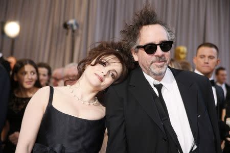 British actress Helena Bonham Carter (L) rests her head on the shoulder of her partner director Tim Burton, nominee for Director of Best Animated Feature film "Frankenweenie," at the 85th Academy Awards in Hollywood, California February 24, 2013. REUTERS/Lucy Nicholson