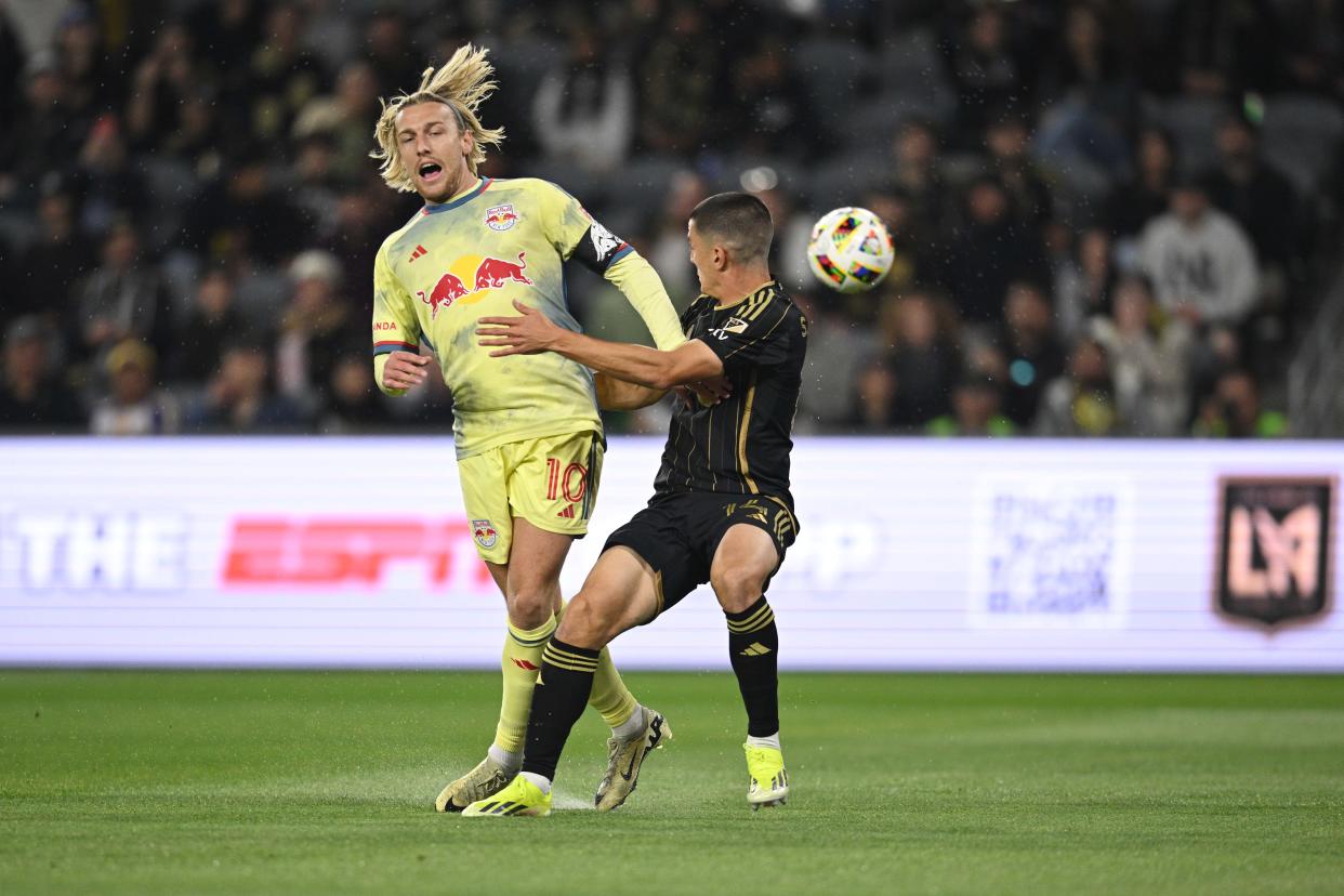 The New York Red Bulls' Emil Forsberg (10) and LAFC's Sergi Palencia (14) collide during last week's 2-2 draw at BMO Stadium.