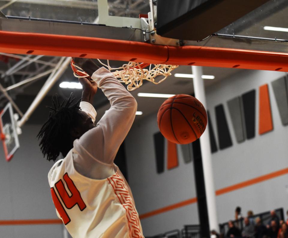 Frank Keller took advantage of his athletic 6-foot, 6-inch frame to throw down three dunks during Ames' victory over Fort Dodge Friday at Ames.