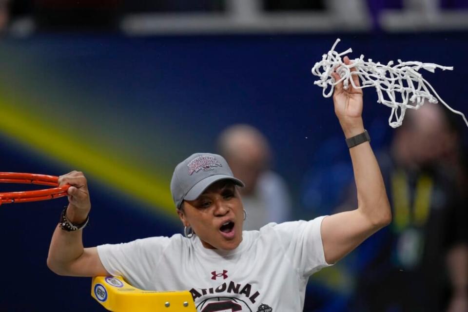 South Carolina head coach Dawn Staley cuts the net after a college basketball game in the final round of the Women’s Final Four NCAA tournament against UConn Sunday, April 3, 2022, in Minneapolis. On Wednesday night, Oct. 12, 2022, Staley accept the Billie Jean King Leadership Award at the Women’s Sports Foundation’s Annual Salute to Women in Sports.(AP Photo/Charlie Neibergall, File)