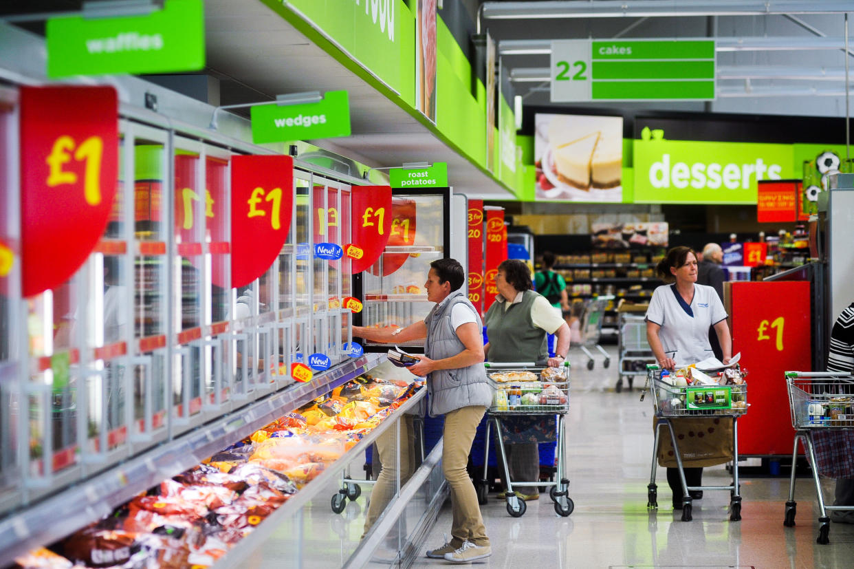 Shoppers in the freezer aisles at Asda