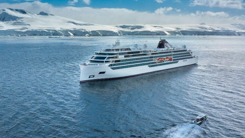 A small cruiser ship at sea just off the coast of Antarctica