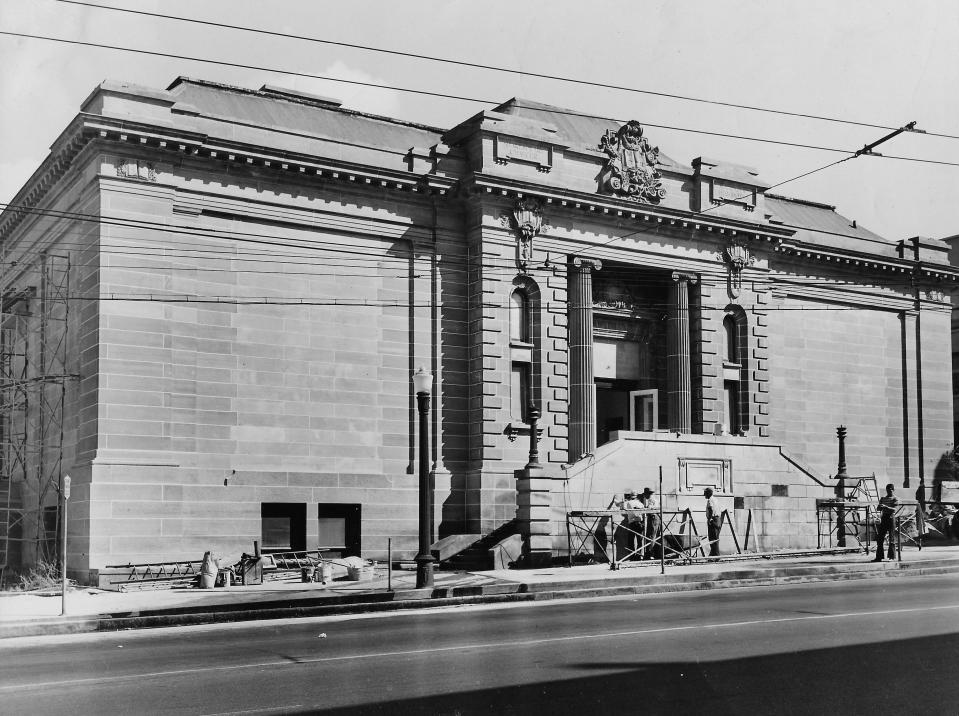 Workers sandblast the exterior of the former Akron Public Library building at East Market and North High streets in 1949. Within a year, it would house the Akron Art Institute.