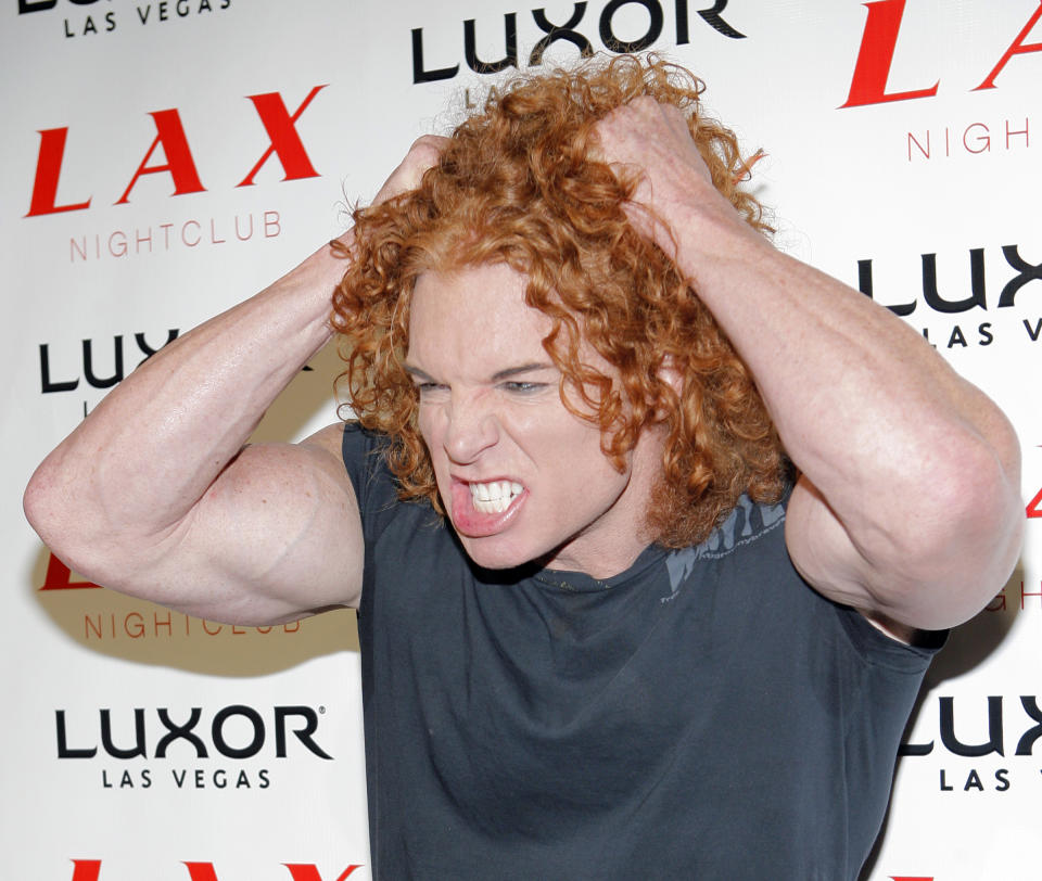 Comedian Carrot Top arrives for the grand opening party of LAX nightclub at the Luxor hotel-casino in Las Vegas, Friday, Aug 31, 2007. (AP Photo/Jae C. Hong)