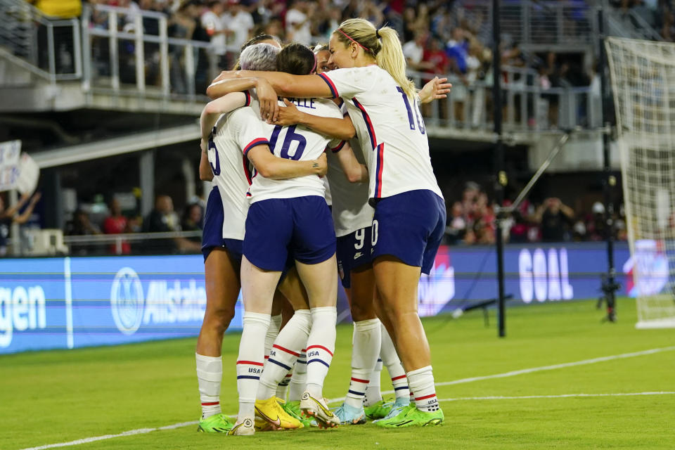 United States players celebrate a goal by Rose Lavelle, center, against Nigeria during the second half of an international friendly soccer match, Tuesday, Sept. 6, 2022, in Washington. (AP Photo/Julio Cortez)