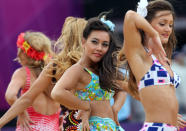 Dancers perform during a beach volleyball match at the 2012 Summer Olympics, Tuesday, July 31, 2012, in London. (AP Photo/Dave Martin)