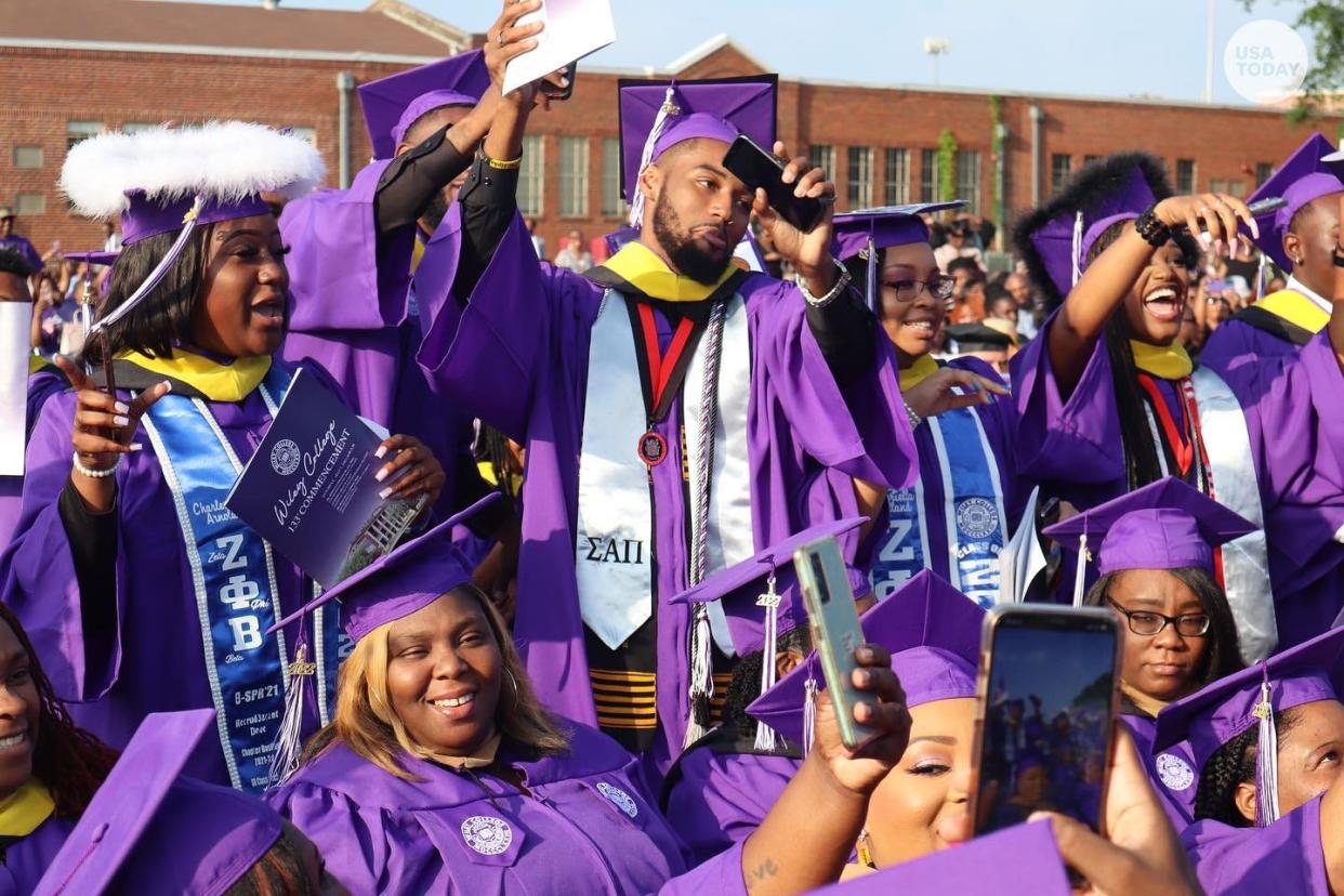 Graduates at Wiley College in Texas celebrate after an anonymous donor paid off their debts.