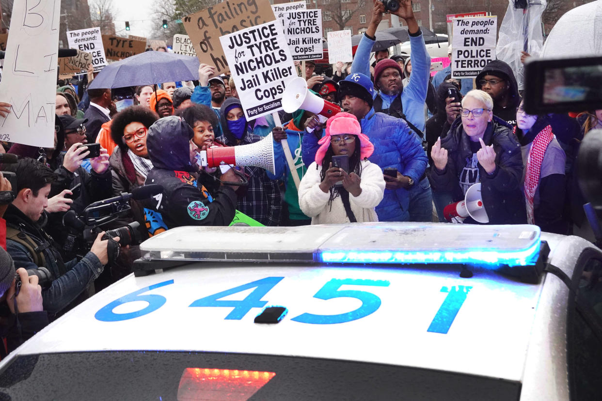 MEMPHIS, TENNESSEE - JANUARY 28: Demonstrators briefly surround a Memphis police car as they march through downtown protesting the death of Tyre Nichols on January 28, 2023 in Memphis, Tennessee. Tyre Nichols died on January 10th, three days after being severely beaten by five Memphis police officers. Yesterday, the city of Memphis released to the public video footage of Nichols' confrontation with the police. Today, it was reported that the Memphis police department disbanded the special operations unit to which the officers were attached.   Scott Olson/Getty Images/AFP (Photo by SCOTT OLSON / GETTY IMAGES NORTH AMERICA / Getty Images via AFP)