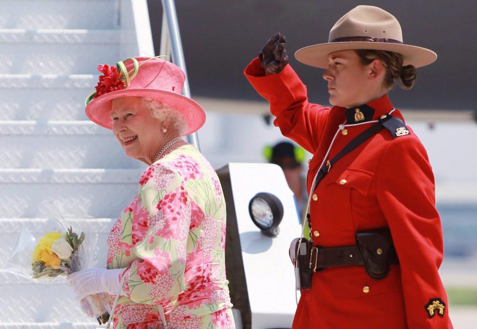 Queen Elizabeth is saluted by an RCMP officer as she leaves Canada after her final visit to the country in July 2010. THE CANADIAN PRESS/Darren Calabrese