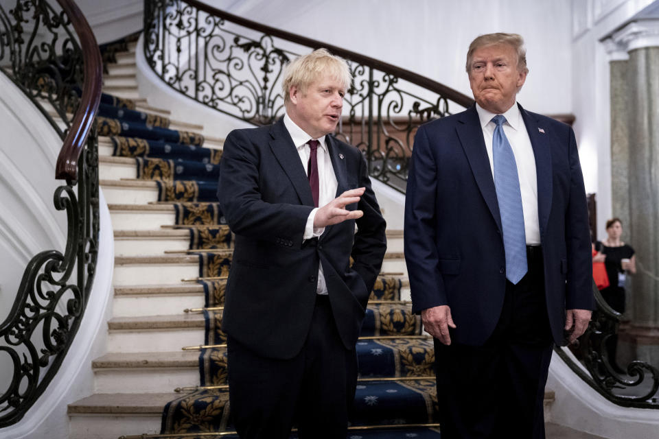 FILE - In this Aug. 25, 2019, file photo, President Donald Trump and Britain's Prime Minister Boris Johnson, left, speak to the media before a working breakfast meeting at the Hotel du Palais on the sidelines of the G-7 summit in Biarritz, France. Johnson says he’ll tell President Donald Trump that the U.K.’s state-funded health service will be off the table in any future trade negotiations, and that the U.S. will have to open its markets to British goods if it wants to make a deal. (Erin Schaff/The New York Times, Pool, File)