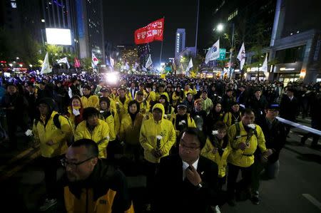 Relatives (in yellow) of victims onboard sunken ferry Sewol march during a rally to commemorate the first anniversary of the Sewol ferry disaster that killed more than 300 passengers, in central Seoul April 16, 2015. REUTERS/Kim Hong-Ji