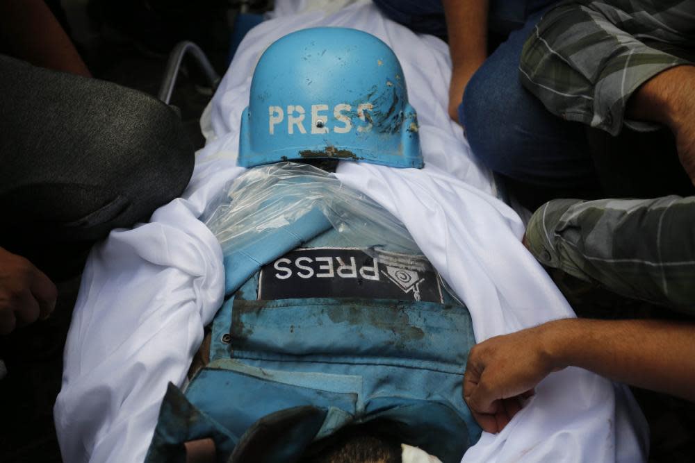 Press helmet and body armour on a shrouded body 