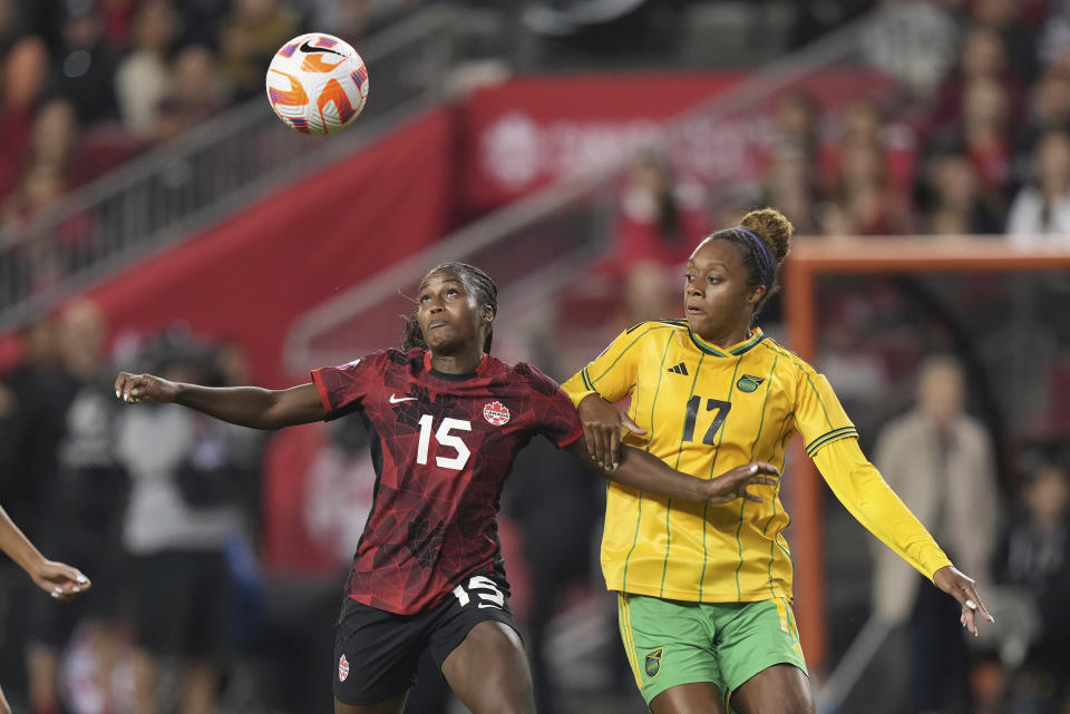 Canada's Nichelle Prince, left, and Jamaica's Allyson Swaby vie for the ball during the first half of the second leg of the CONCACAF championship soccer series in Toronto on Tuesday, Sept. 26, 2023. (Nathan Denette/The Canadian Press via AP)