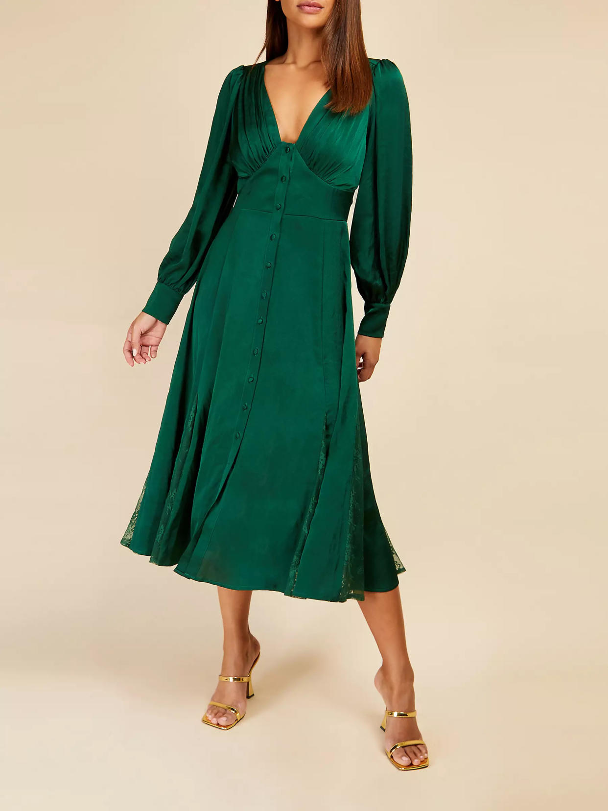 This flattering bottle green number could be worn all year round. (John Lewis)