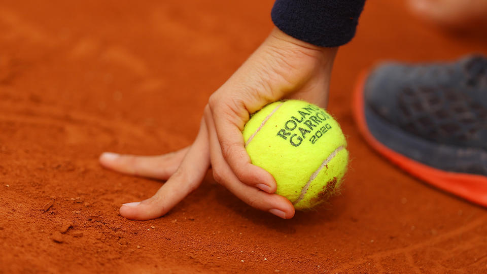 A ball kid, pictured here holding a tennis ball on day four of the 2020 French Open.