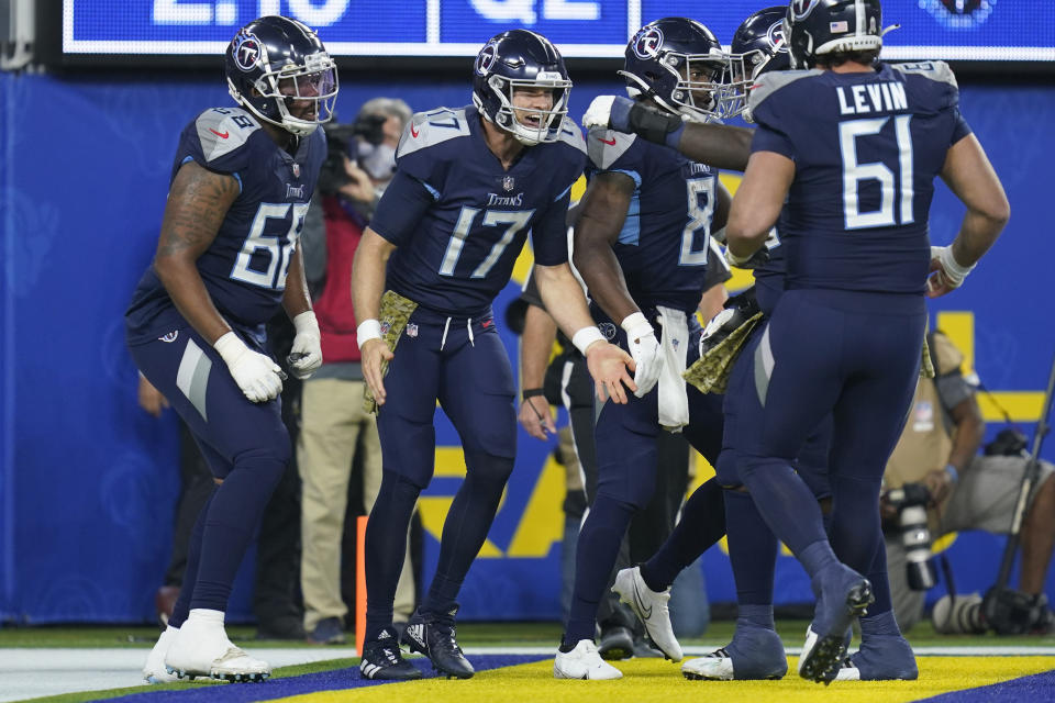 Tennessee Titans quarterback Ryan Tannehill, center, reacts after scoring a touchdown during the first half of an NFL football game against the Los Angeles Rams, Sunday, Nov. 7, 2021, in Inglewood, Calif. (AP Photo/Ashley Landis)