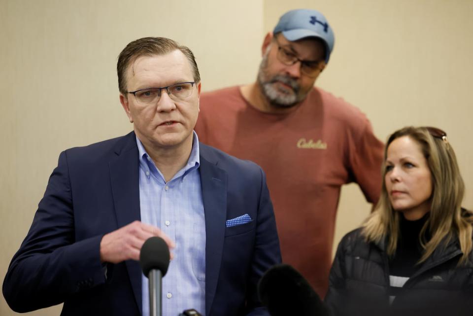 Keith Wilson speaks during a news conference as truckers and supporters continue to protest COVID-19 vaccine mandates in Ottawa on Feb. 3, 2022. Beside him are protest organizers Tamara Lich and Chris Barber. 