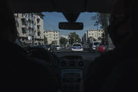 Police officers patrol in a car in the Paris suburb of Sarcelles, Tuesday, June, 15, 2021. In the run-up to France's presidential elections in 2022, crime and policing are again becoming hot-button issues. Some political opponents of President Emmanuel Macron argue that France is becoming an increasingly violent country. (AP Photo/Lewis Joly)