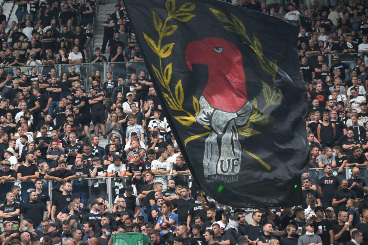 Eintracht Frankfurt supporters waving a huge flag gather in the stands for the start of the UEFA Champions League Group D football match between Olympique Marseille (OM) and Eintracht Frankfurt at Stade Velodrome in Marseille, southern France on September 13, 2022. (Photo by NICOLAS TUCAT / AFP) (Photo by NICOLAS TUCAT/AFP via Getty Images)