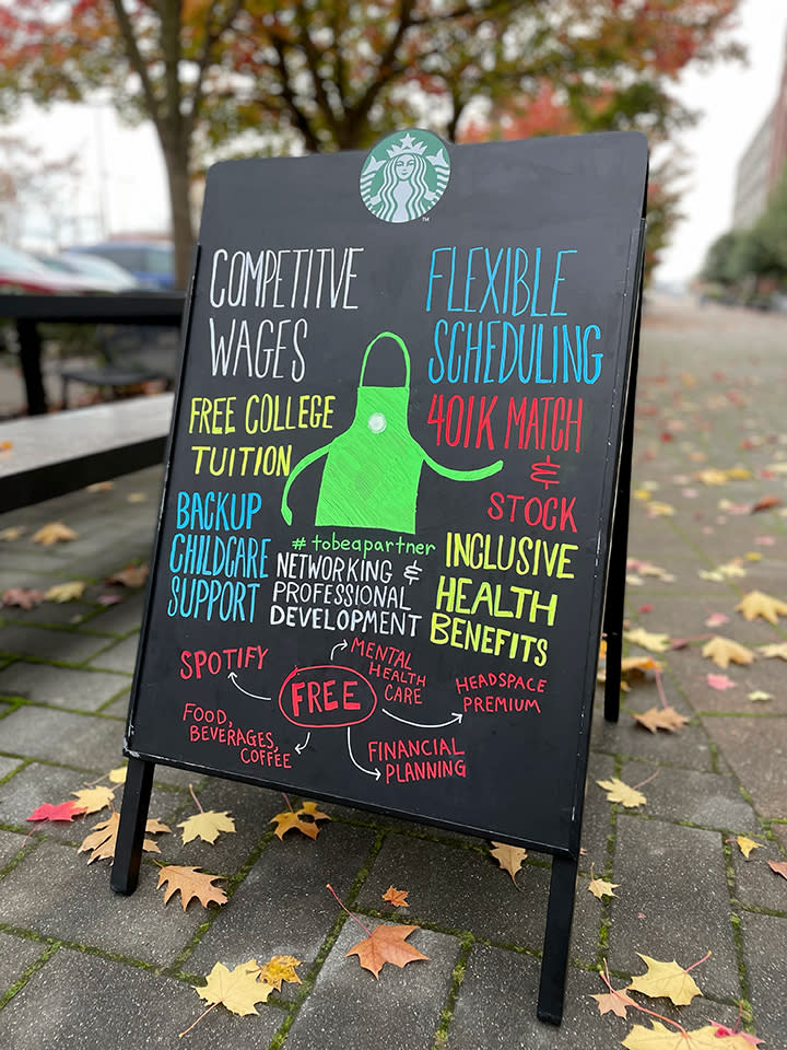 Starbucks signage outlines the perks of being a partner. (Courtesy: Starbucks)