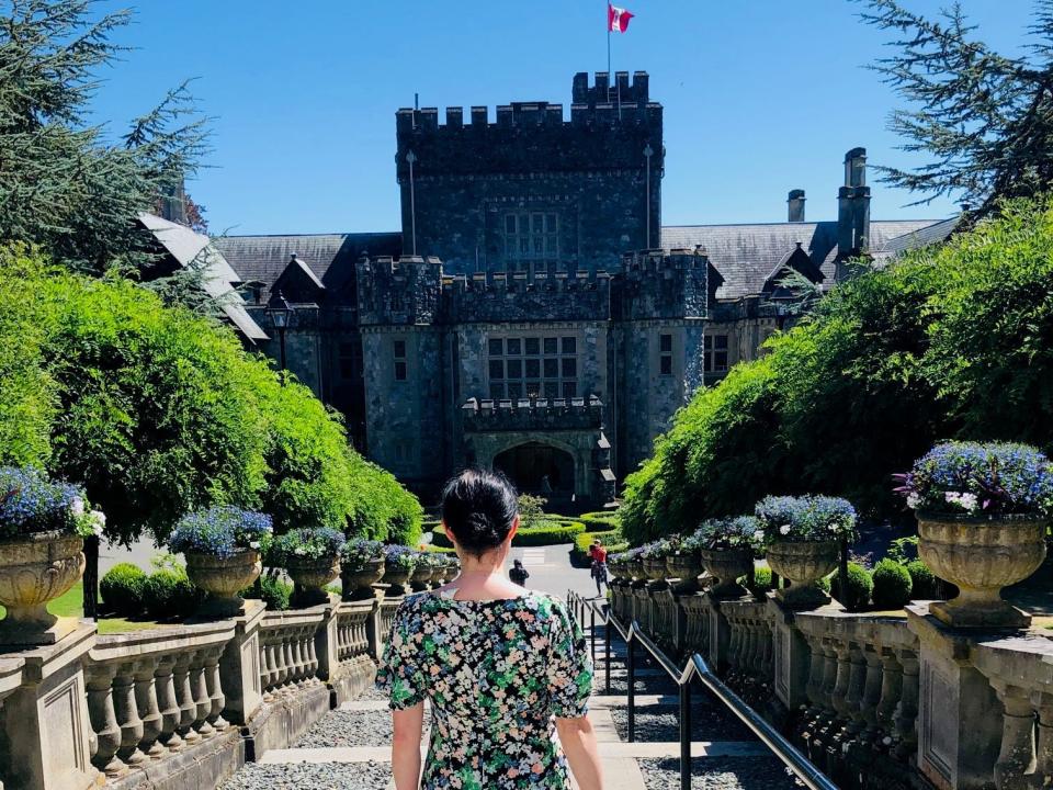 simone walking toward hatley castle in victoria castle