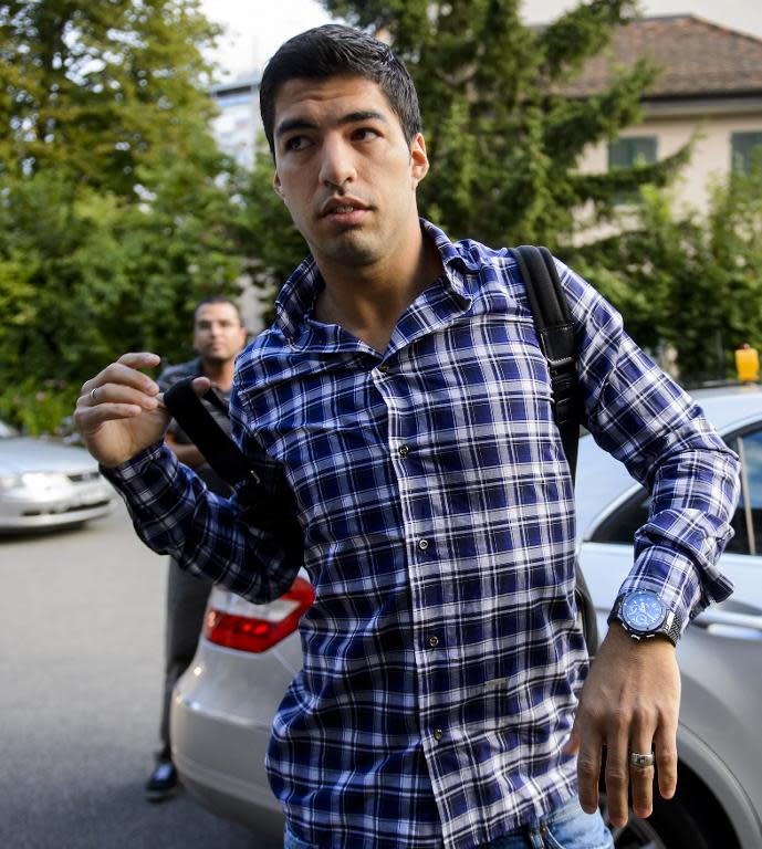 Barcelona forward Luis Suarez, currently serving a four-month suspension, arrives for his appeal before the Court of Arbitration for Sport in Lausanne on August 8, 2014