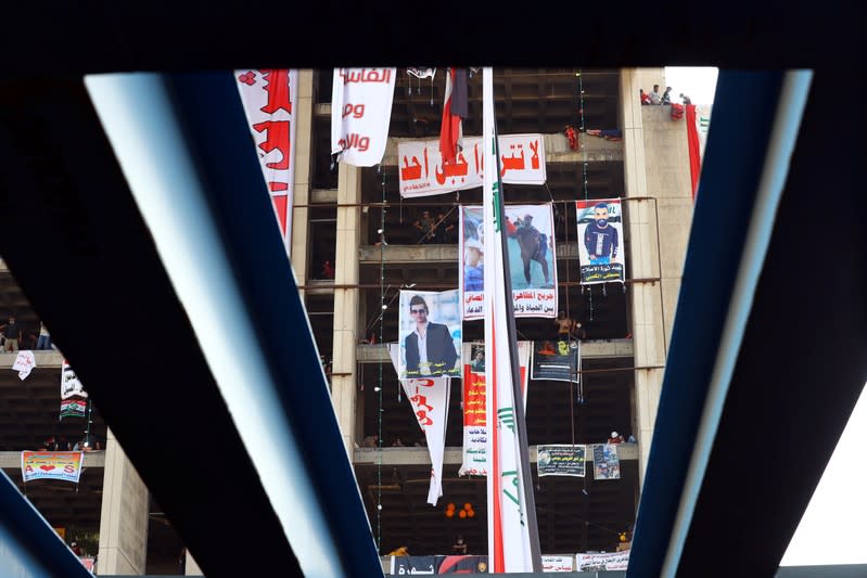 Iraqi demonstrators are seen inside the high-rise building, called by Iraqi the Turkish Restaurant Building, during anti-government protests in Baghdad