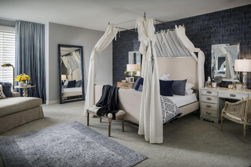 <p>A bedroom from <a href="https://deringhall.com/interior-designers/suza-design" rel="nofollow noopener" target="_blank" data-ylk="slk:Süza Design;elm:context_link;itc:0;sec:content-canvas" class="link ">Süza Design</a> features soft, posh details including bed curtains.</p>
