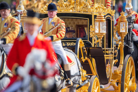 Britain's Queen Elizabeth rides in the State Carriage during a state visit by King Willem-Alexander and Queen Maxima of the Netherlands, in London, Britain October 23, 2018. Victoria Jones/Pool via REUTERS