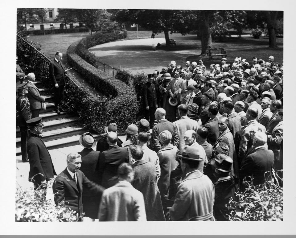 President Calvin Coolidge speaking to a group of people.