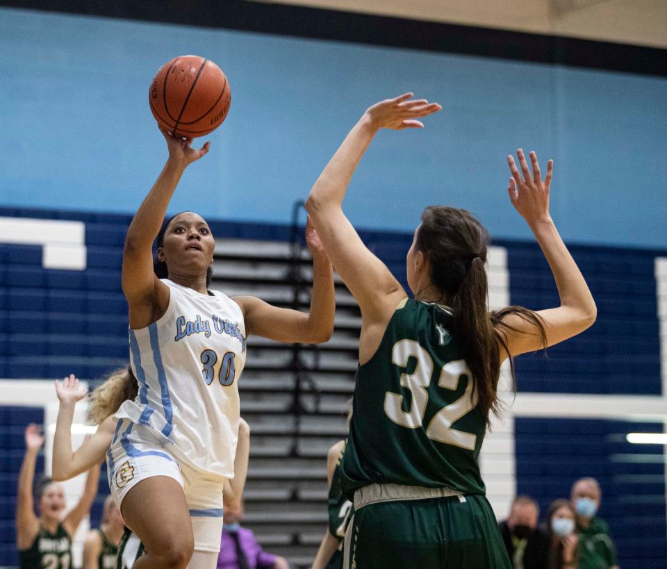 Guilford's Sydney Donaldson shoots the ball over Boylan's Lily Esparza at Guilford High School on Thursday, Feb. 10, 2022, in Rockford.